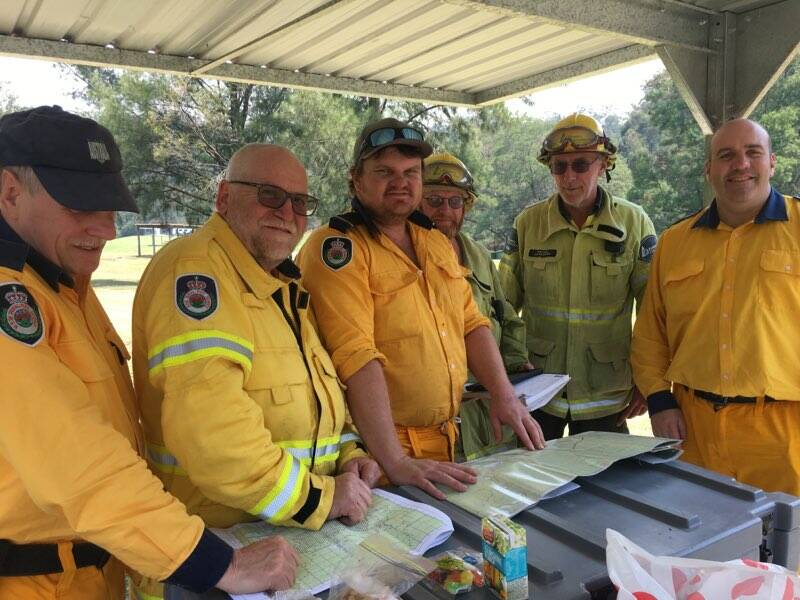 North Cambewarra RFS members Phillip Milligan, Paul Fraser, Dave Toovey and Matt Meldrum (far right) with Forestry's Dean Evans and Peter Gladwin at Shallow Crossing Camping Ground on November 27.