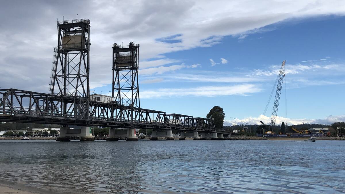 View of the Batemans Bay Bridge and construction works from the northern foreshore, looking south. RMS will be switching water utility services north of the Batemans Bay Bridge on June 12 and another night later in June as part of the continued work on the new bridge. 