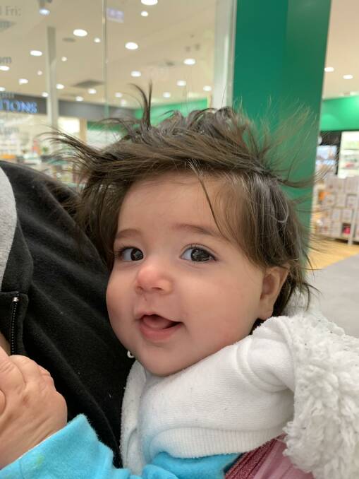 Never a bad hair day: Gorgeous six-month-old Airlie Blacksmithson turns heads in the shopping centre. 