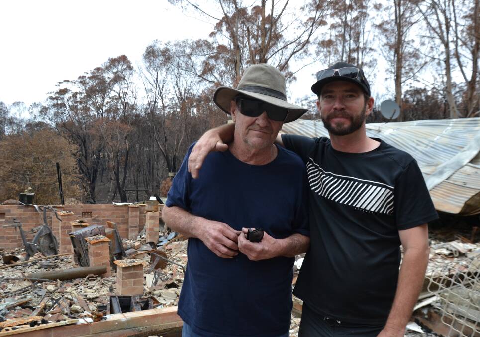THIS IS HOME: Colin and Jacob Brennan, father and son, at their Nerrigundah home which was destroyed by bush fire on New Year's Eve.