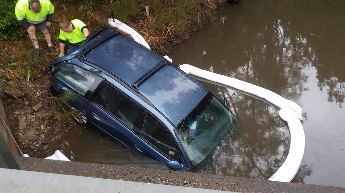 A car veered off George Bass Drive, Rosedale, into a creek. Picture: Batemans Bay Fire and Rescue.