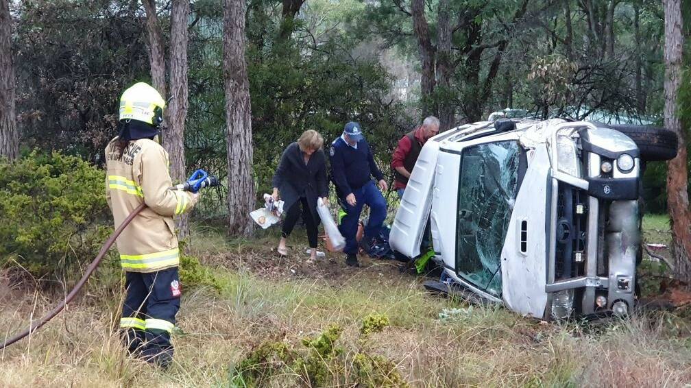 A car has rolled after wet weather at the Princes Highway, south of Moruya on Sunday afternoon, July 12.