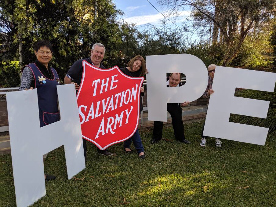HOPE: Batemans Bay Salvation Army volunteer Marti Vann, store manager Craig Macklan, admin officer Shelley Macklan, Lt Ben Knight and volunteer Dot Hawke.