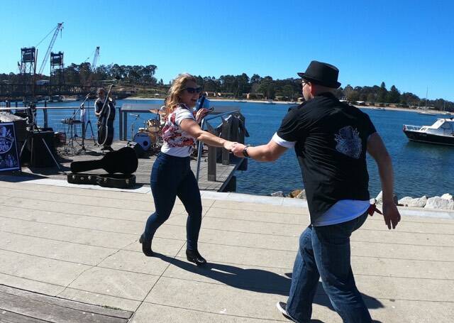 Shellee Williams and Batemans Bay's Rock n Rollers instructor Chris Tague get their feet moving on Sunday, September 1 at the Batemans Bay foreshore. Picture: Krystle Mears.