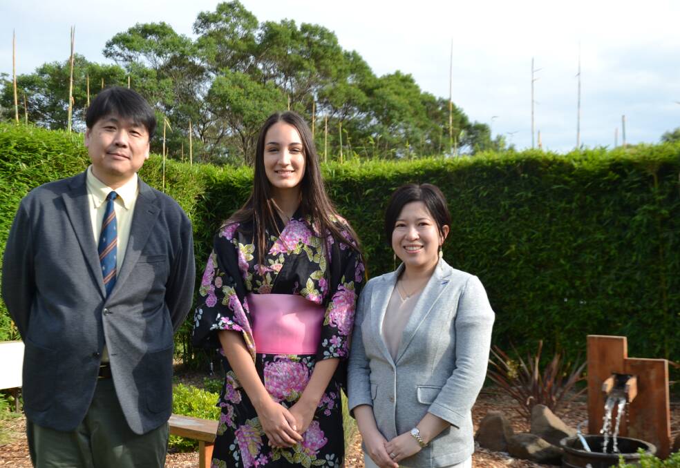 St Peter's Anglican College student Tara Watts (centre) with Myojo Gakuen Senior High School vice-principal Takashi Ishii (left) and colleague Akiko Oishi (right). Ms Watts' kimono was a gift from her host family when she studied in Japan.