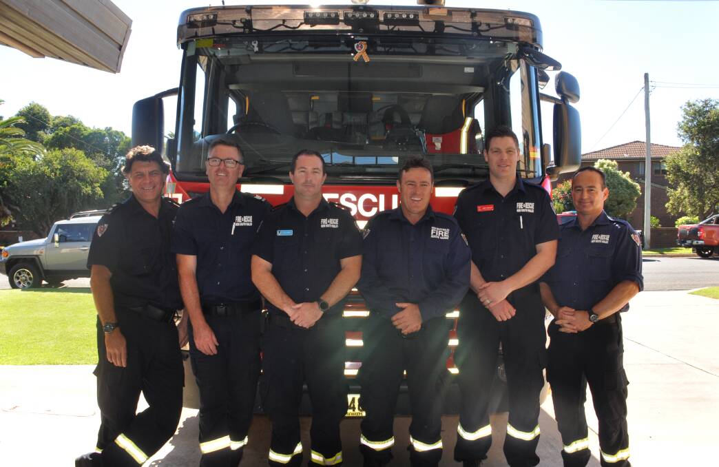 Batemans Bay Fire and Rescue firefighters Craig Mashman, Nathan Pascoe, Paul Lyons, David Clarke, Brett Garland and Jamie Ridley were called to a house fire minutes after this photo was taken.