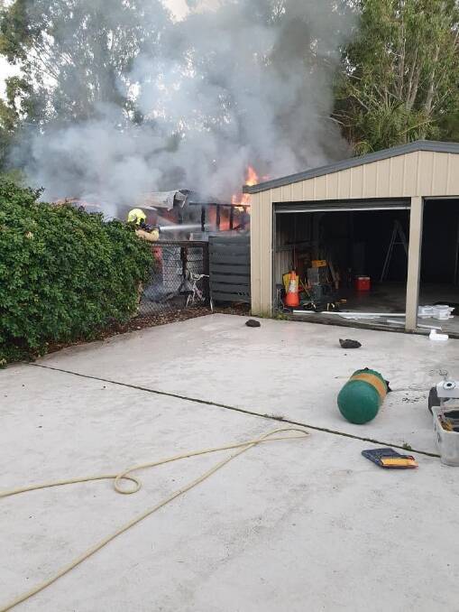 A neighbour empties her garage in case flames spread. Image: supplied