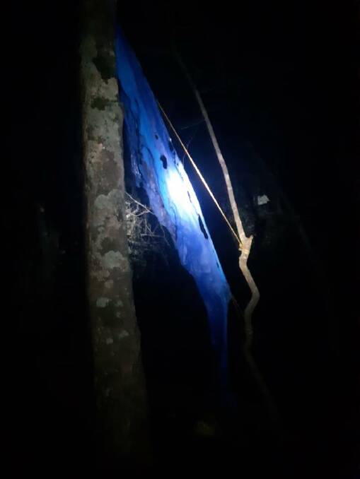What's left of a blue tarp near the unattended campfire. Image: Batemans Bay RFS