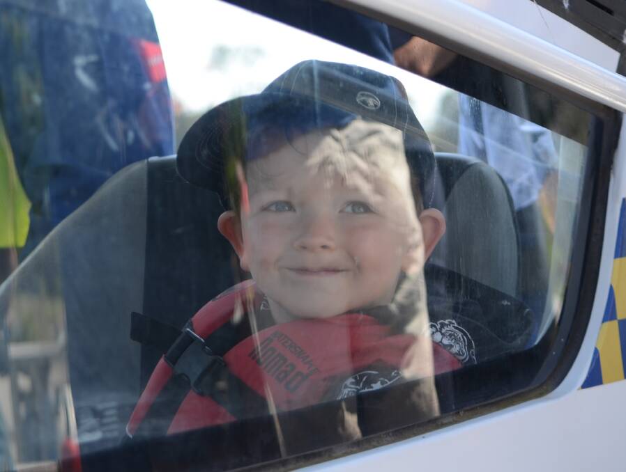 Four-year-old Darcy Marr excited to fly down the Moruya River by boat, as a 'thank you' from Marine Rescue volunteers.
