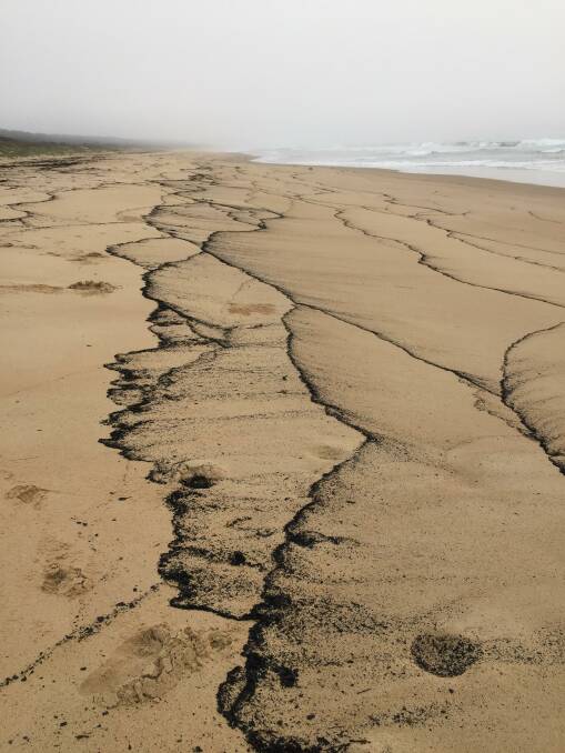 Low tide on the Windsock beach, Moruya. "The ash in the water has left beautiful patterns on the sand. The worst returns with beauty": Picture: Sarah and Michael Guppy