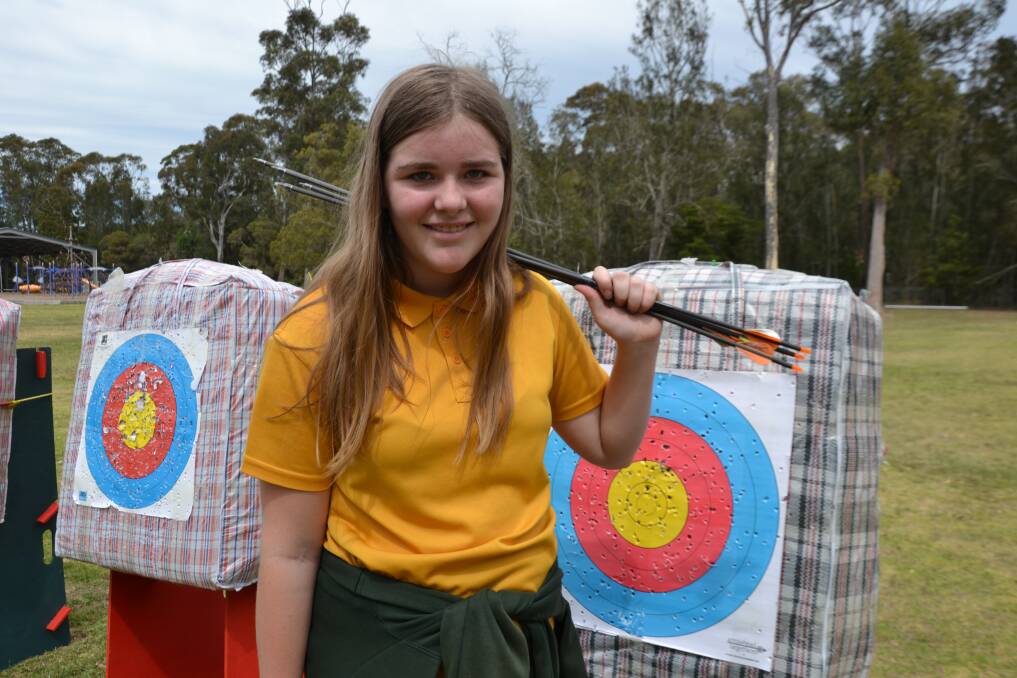 Year 6 Sunshine Bay Public School pupil Sommer Cooke, of Batehaven, collects her arrows during archery training with PCYC.