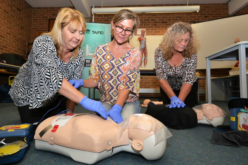 TAFE NSW First Aid teacher Georgie McInerney offers life-saving skills to student Sandra Davis.