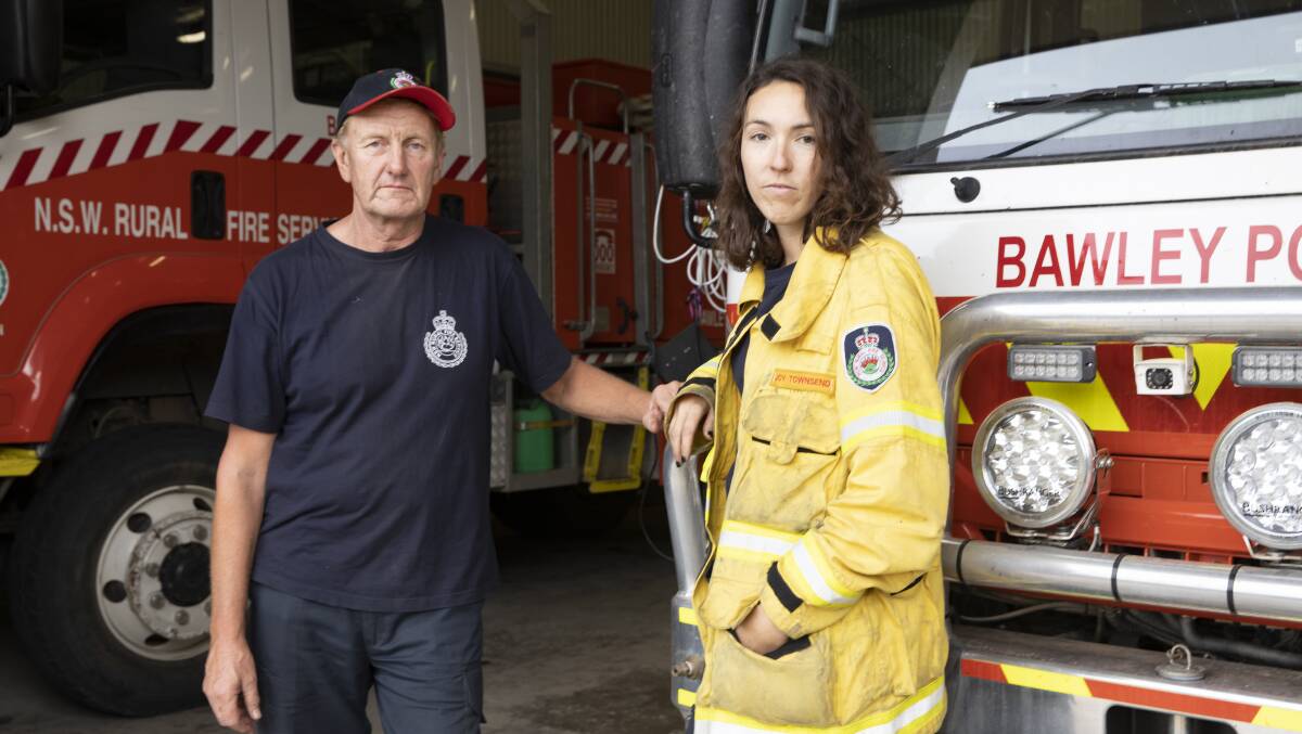 Charlie Magnuson with volunteer firefighter Joy Townsend last year, the day before fire hit the village. Picture: Sitthixay Ditthavong