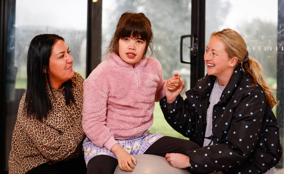 FIGHTING: Skye Robson, centre, with carers Bree Pellow (left) and Teghan Henderson who started the Steps for Skye fundraising campaign three years ago to help fund research toward a cure for Sanfilippo syndrome. Picture: Luke Hemer