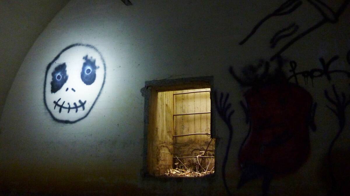 Graffiti artists have left their mark inside the Broulee World War II radio post bunker.
