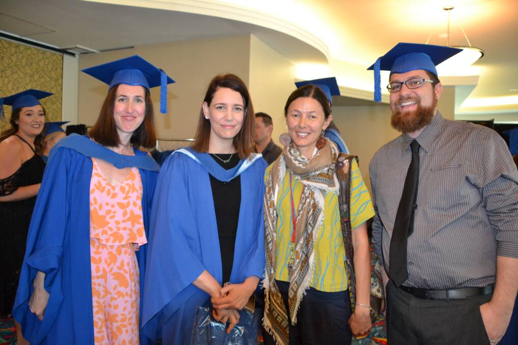 RELATIONSHIPS: Hnoours graduate, Leonie Tan (centre right) with some of her university 'family'.