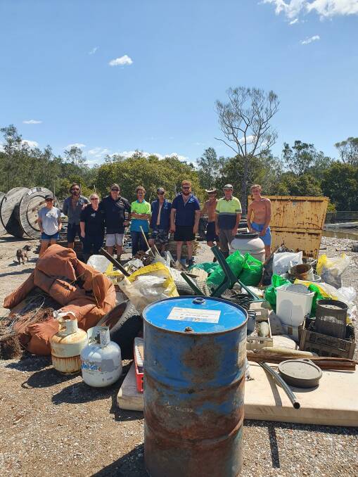 Shoalhaven oyster farmers remove a mountain of rubbish from the river in 2020.