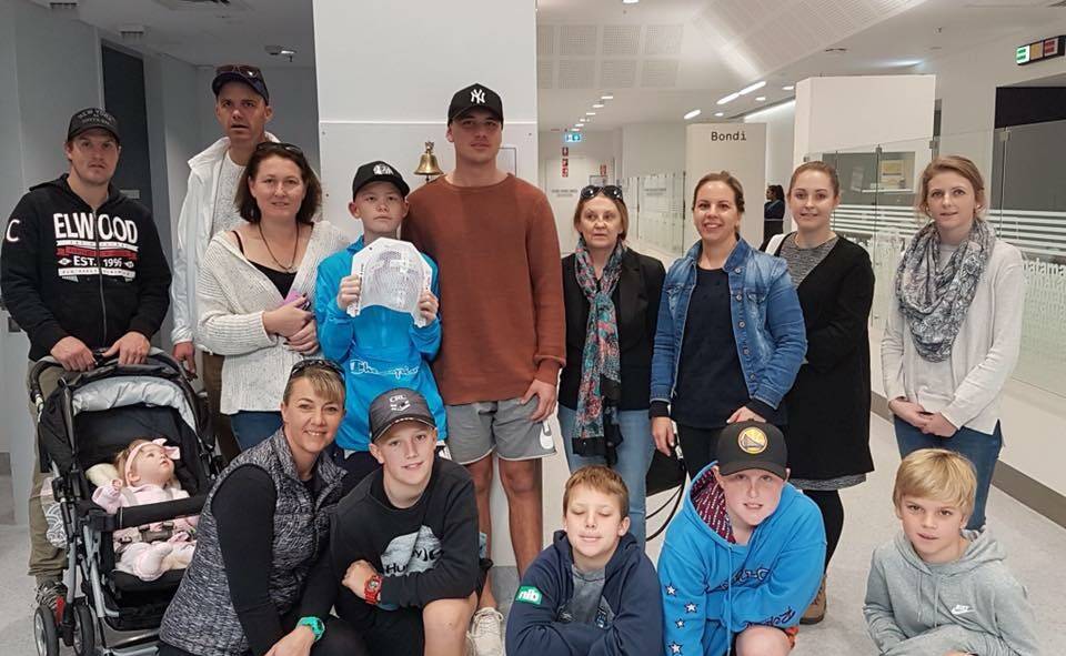 HOMEWARD BOUND: Eli Chatfield's last day of radiation on July 20, surrounded by family and friends. He is due to leave hospital and hopes to get some time on the footy field before commencing chemotherapy.