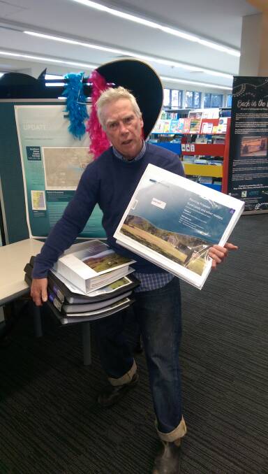 Noel Plumb, of Coastwatchers, with the Rural Lands Strategy public exhibition documents.