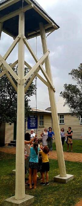Shire kids ring bells for children on Nauru