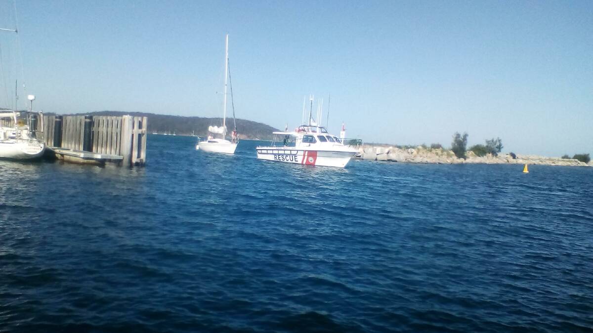 A yacht being towed back into the marina by Batemans Bay Marine Rescue on Saturday.