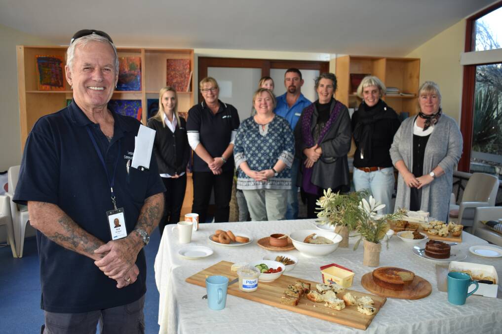 Community Care volunteer Rick Windsor (front left) was recognised for his years of service at a morning tea on Friday. 