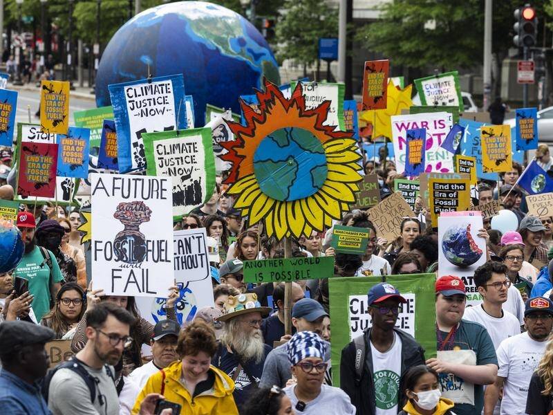 Earth Day marchers have tried to ram home the urgency of action to limit climate change. (EPA PHOTO)