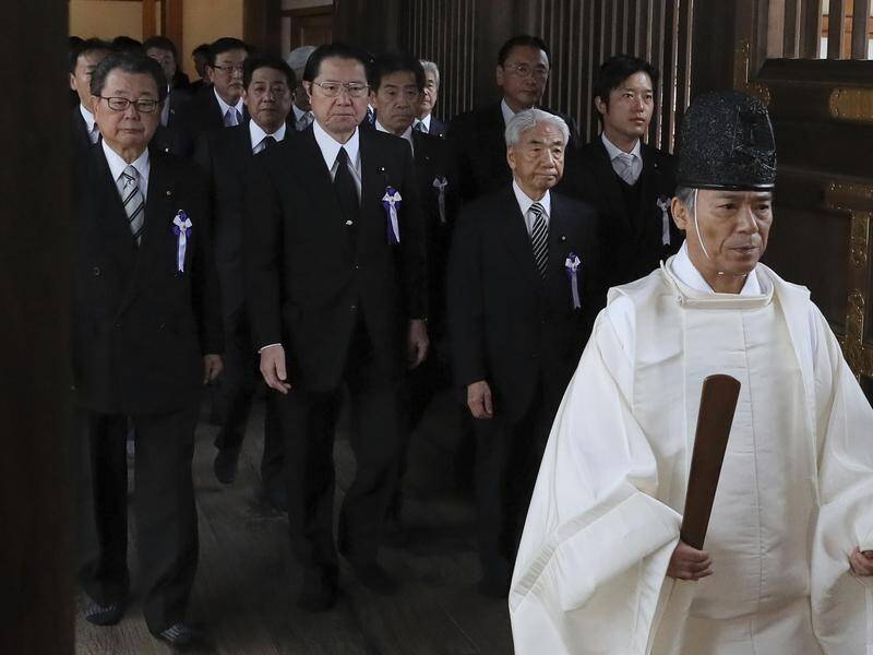 Japanese MPs visited the Yasukuni Shrine, which honours war criminals as well as the war dead.