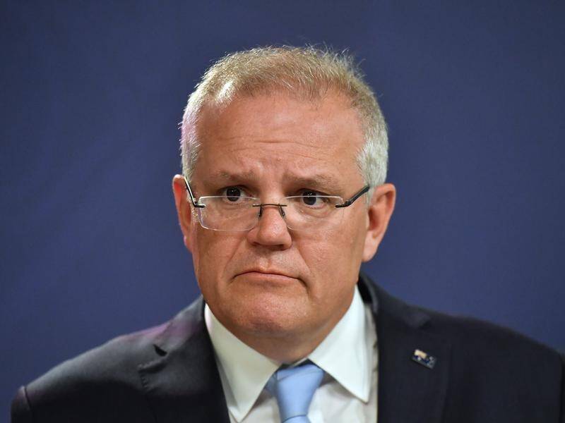 Prime Minister Scott Morrison has been verbally abused during a visit to a bushfire-hit NSW town.