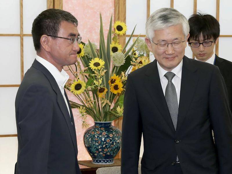 Japanese Foreign Minister Taro Kono (L) met South Korean Ambassador Nam Gwan Pyo in Tokyo on trade.