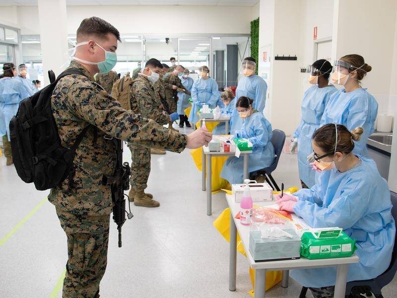 A US marine has tested positive to the coronavirus on his arrival in Darwin and is in quarantine.