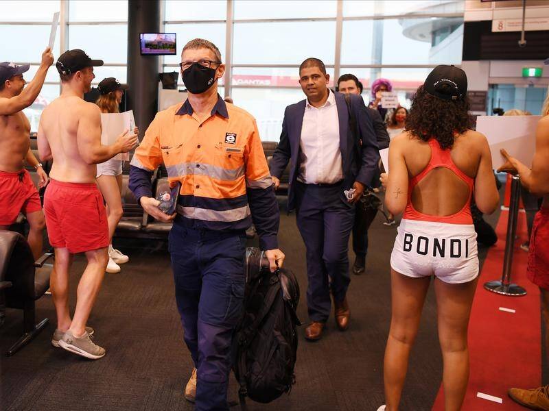 Air passengers from Melbourne were greeted at Sydney airport by models dressed as lifesavers.