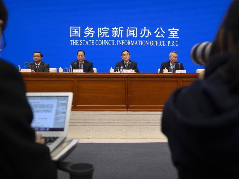 Chinese party officials slammed the US political system, ahead of a global summit on democracy.