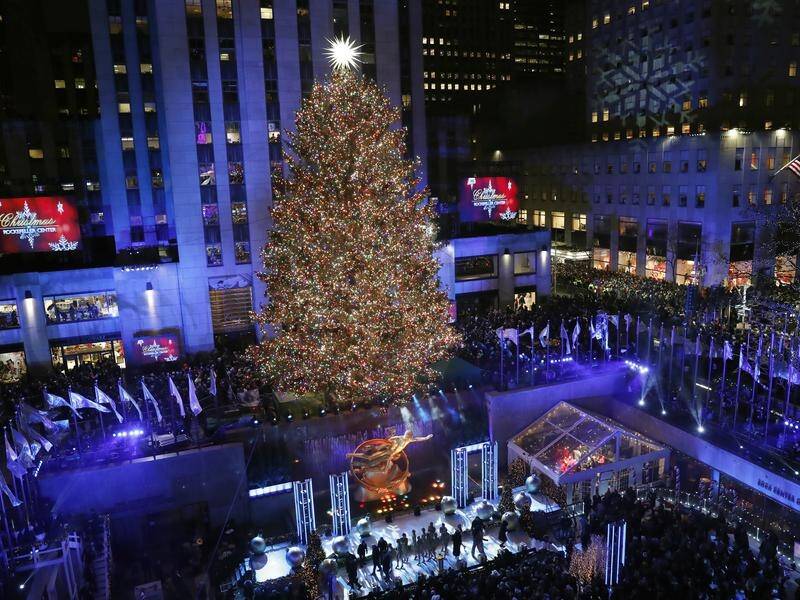 The 87th annual Rockefeller Center Christmas Tree is illuminated in New York.