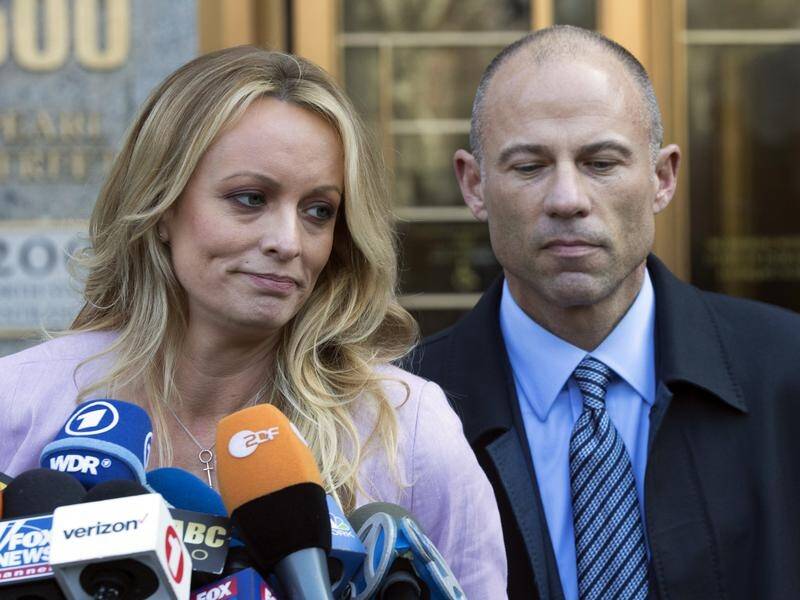 US lawyer Michael Avenatti (R) has been charged with ripping off client Stormy Daniels (L).