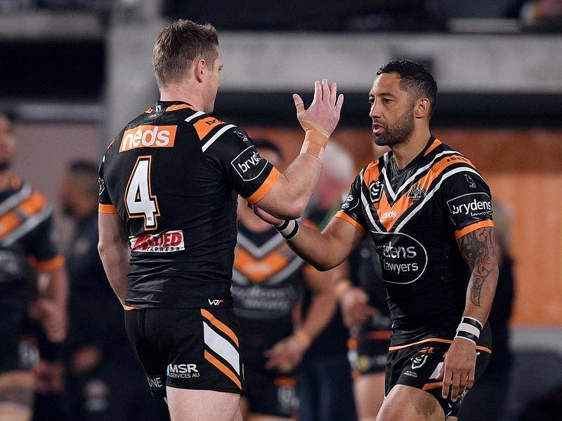 Benji Marshall (r) retired hurt from his final game for the Tigers as they lost 28-24 to Parramatta.
