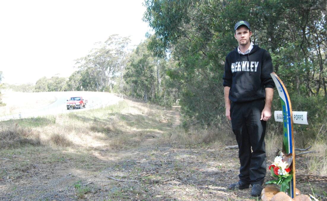 James Bugden at the roadside shrine to his father, Max, on the ‘Mad Mile’ just south of Batemans Bay. 