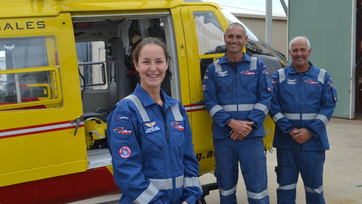 SKY HIGH: Samantha Law, South Coast Westpac Lifesaver Helicopter’s newest rescue crew officer with pilot Rob Wildman and air crewman Trevor Crackwill. 