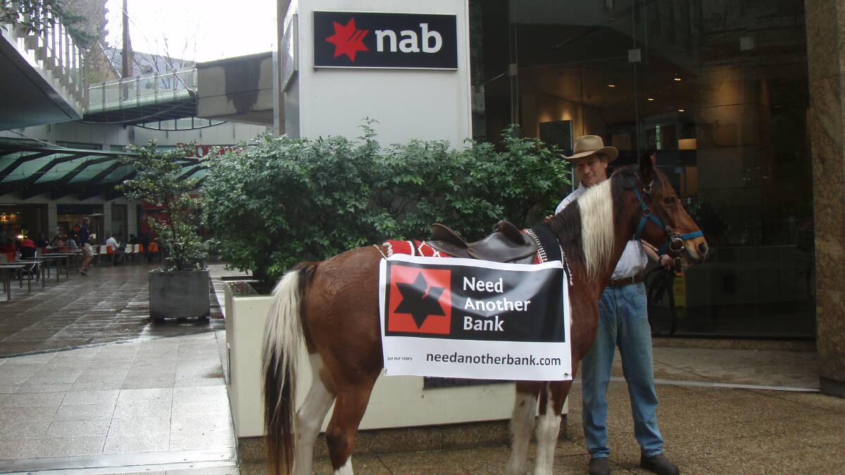 HAPPY HORSEMAN: Braemar Farm owner Kim Hall is delighted work is getting underway for a 38-lot residential subdivision on the Moruya property. He is pictured here taking his horse into National Australia Bank headquarters in Sydney in June.
