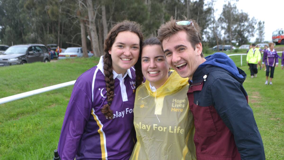 Grace Swadling, Emma Gill and Thomas Walsh rugged up before they took to the track together 