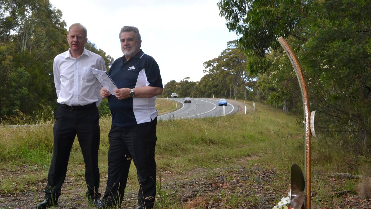 LEARNING CURVE: NRMA engineer Mark Wolstenholme and NRMA South Coast director Alan Evans at a fatal curve on the ‘mad mile’ on the Princes Highway, Batemans Bay. The ‘mad mile’ is listed as a high-risk area in a newly released safety audit of the highway.