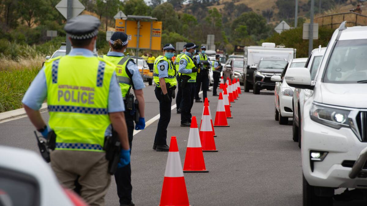Police check cars entering the ACT via the Federal Highway. Picture: Elesa Kurtz