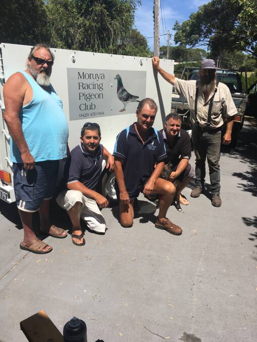Members of the Moruya Racing Pigeon Club, including race-winner Mario Magrin (second from right).