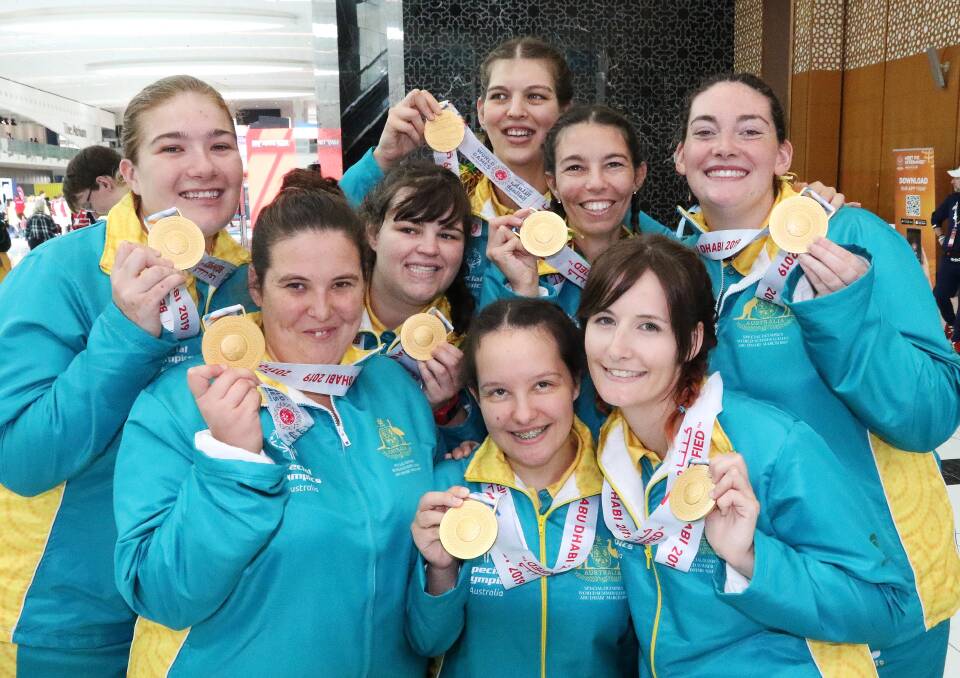 Madison Howard-Windley (third from left) celebrates with the Australian women's basketball team after winning a gold medal at the Special Olympics World Games.