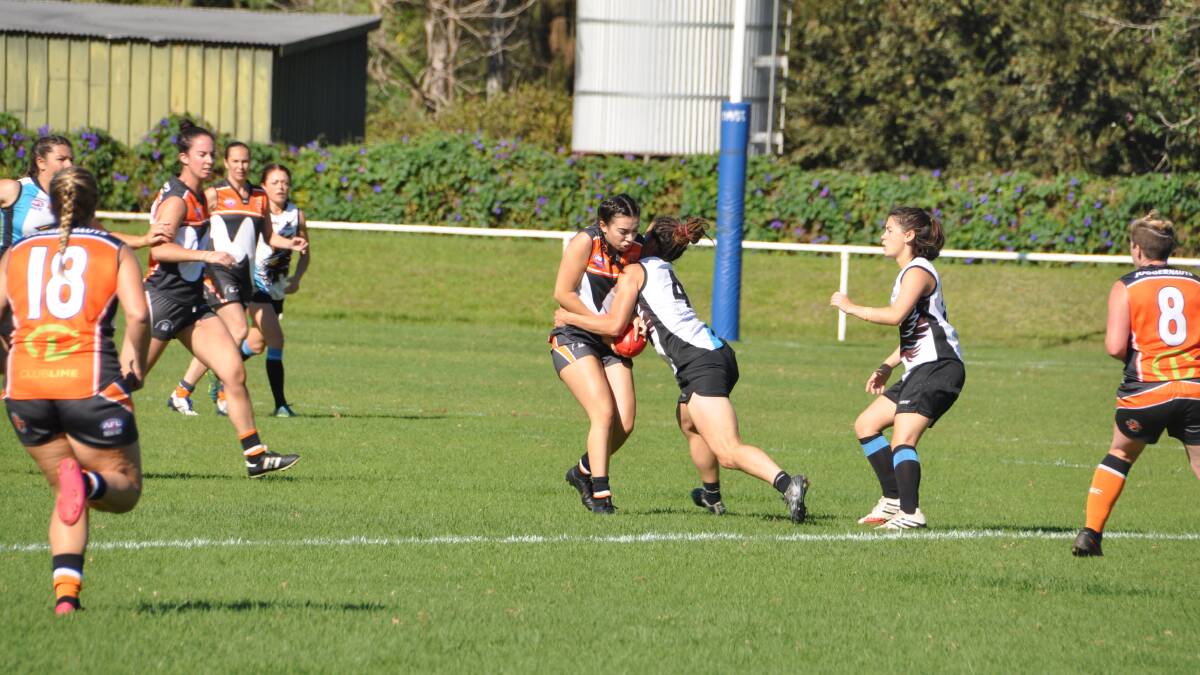 The Batemans Bay Seahawks, pictured playing Molonglo at Hanging Rock Oval in April, survived an OT thriller to qualify for the grand final.