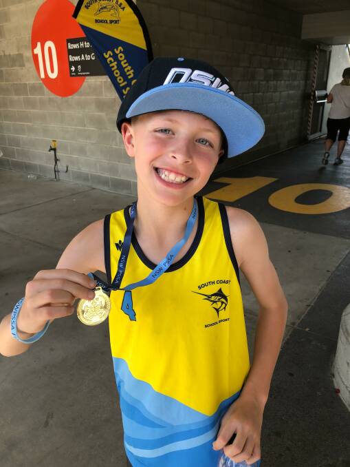 ALL SMILES: Broulee Primary School student Jacob Borg with his gold medal after winning the 100m at the NSWPSSA Primary Athletics Championships. Photo: Chris Borg