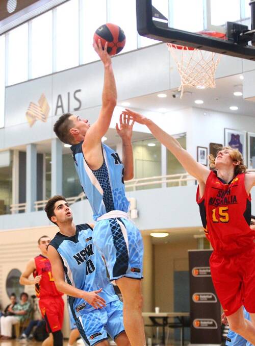 Riley O'Shannessy scores two points during a match against South Australia at the under 20s National Junior Championships in Canberra. Photo: Basketball Australia.