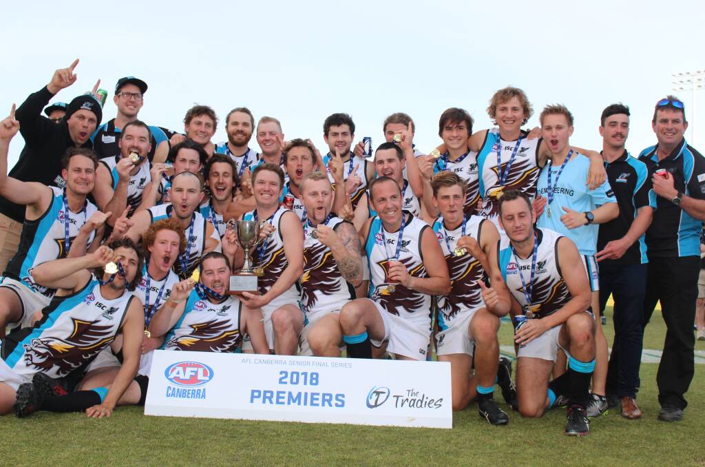 CHAMPIONS: The Batemans Bay Seahawks celebrate after their 26-point win over the Molonglo Juggernauts in the AFL Canberra third-grade grand final. Photo: Sinead Pearson/AFL Canberra.