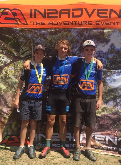 FLYERS: Christopher Usher, Jack McFarlane, and Nicholas Usher with medals they won at the Snowies Mountain Bike Festival in Thredbo.