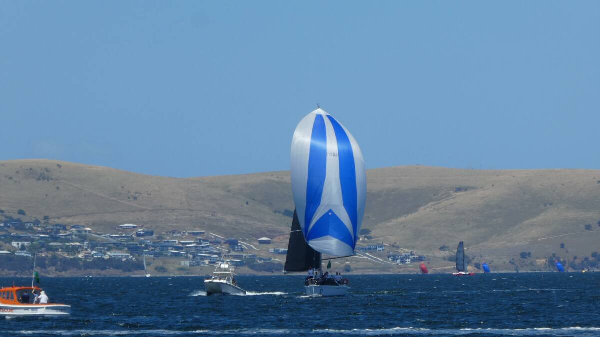 FINAL STRETCH: Pelagic Magic makes her way down the Derwent River at the end of the Sydney to Hobart Yacht Race. Photo: Provided.